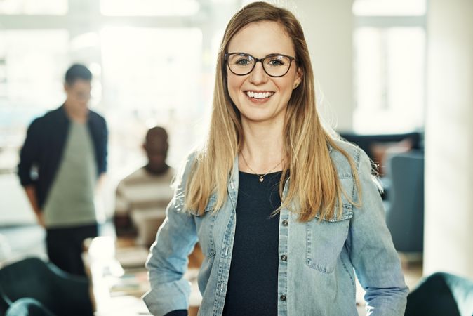 Portrait of professional creative woman in office wearing jean jacket