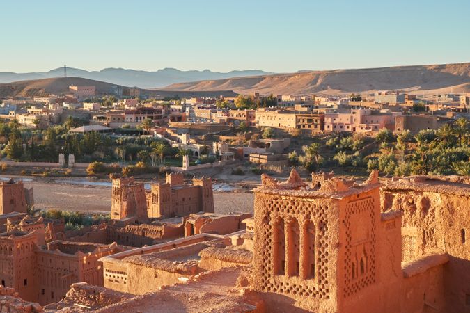 Ancient city near river in desert and wonderful sky