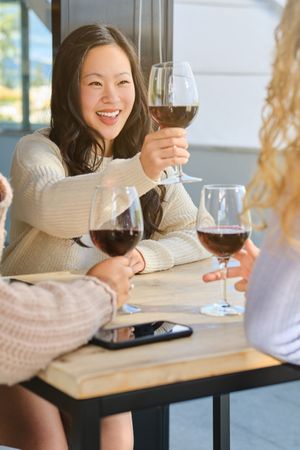 Smiling woman with glass of wine