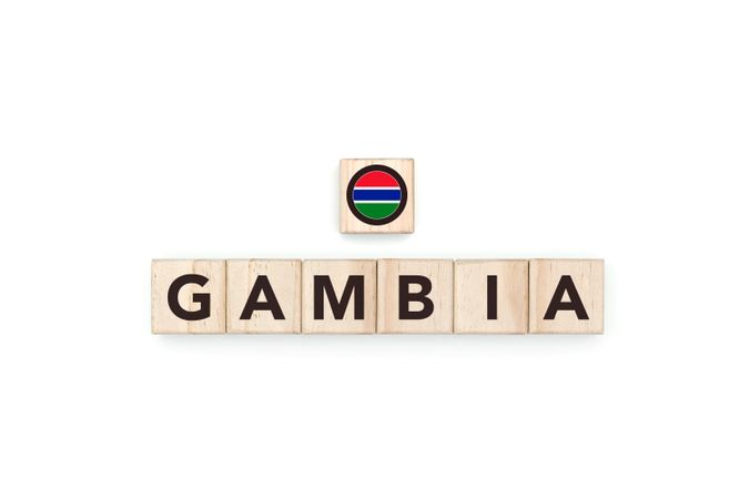 Wooden blocks bearing the name and flag of Gambia.