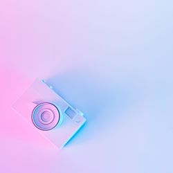 Vintage camera in vibrant bold gradient purple and blue holographic colors