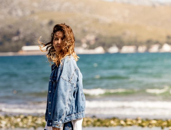 Young woman walking on seashore