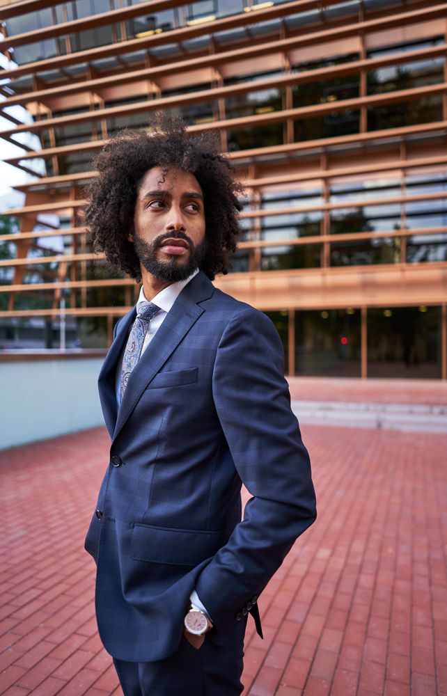 Confident businessman looking over shoulder