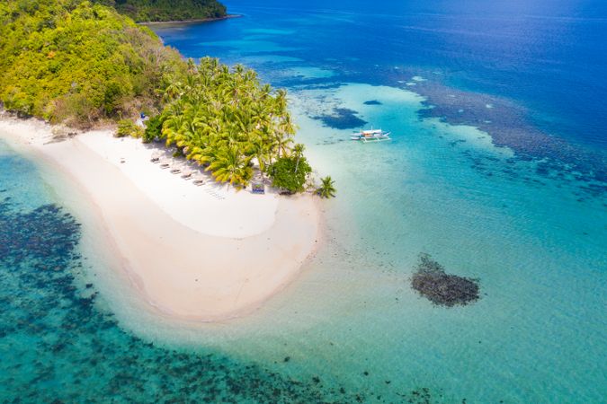 Aerial view of tropical island among blue water