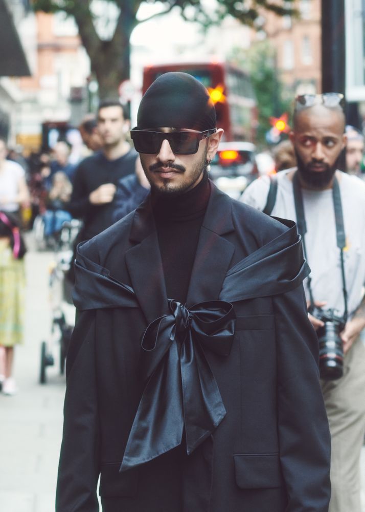 London, England, United Kingdom - September 18 2021: Sikh man in stylish dark suit with large bow