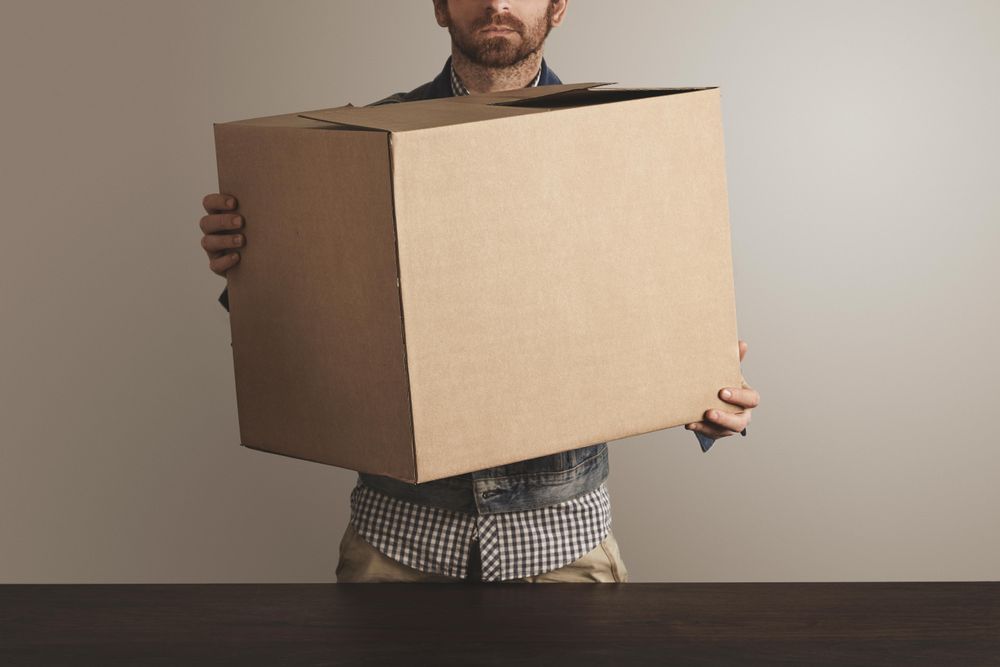 Man holding cardboard box