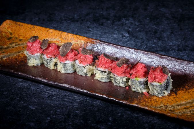 Tempura sushi rolls of tuna on plate