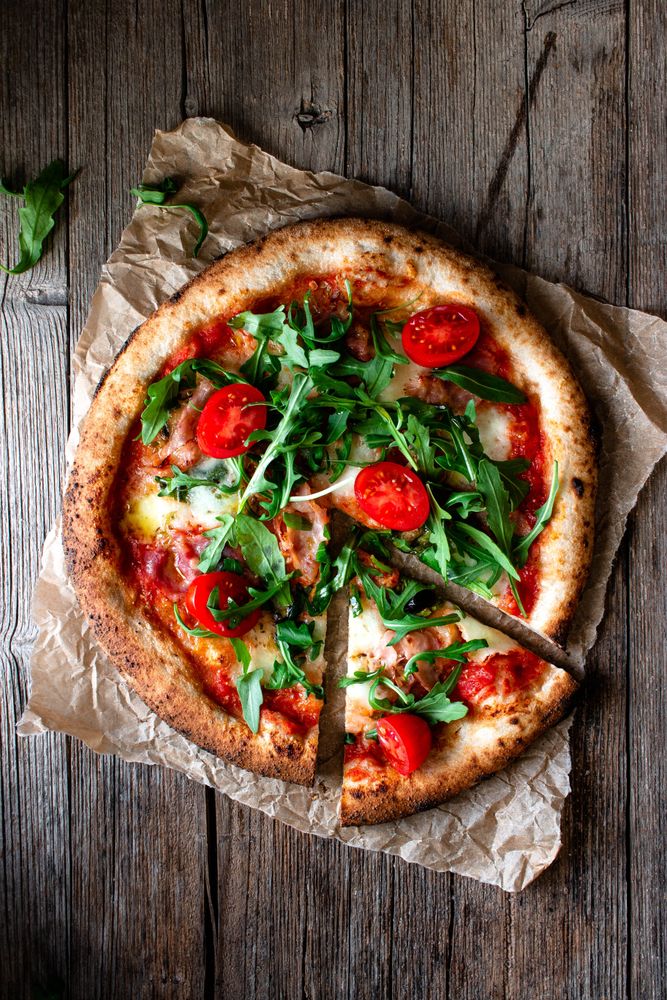 Appetizing pizza placed on wooden table