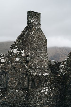 Aged stone window frame with landscape