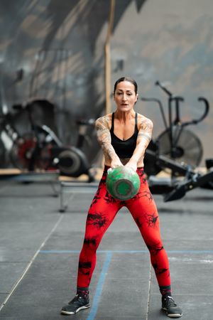 Woman doing kettlebell swings