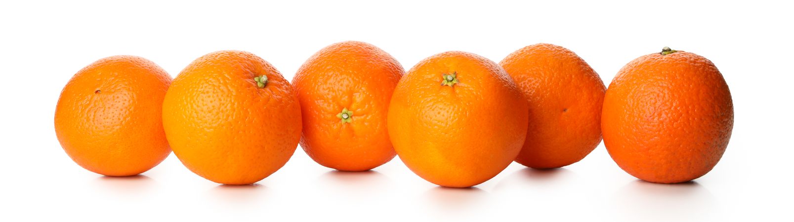 Group of ripe mandarins isolated on light background