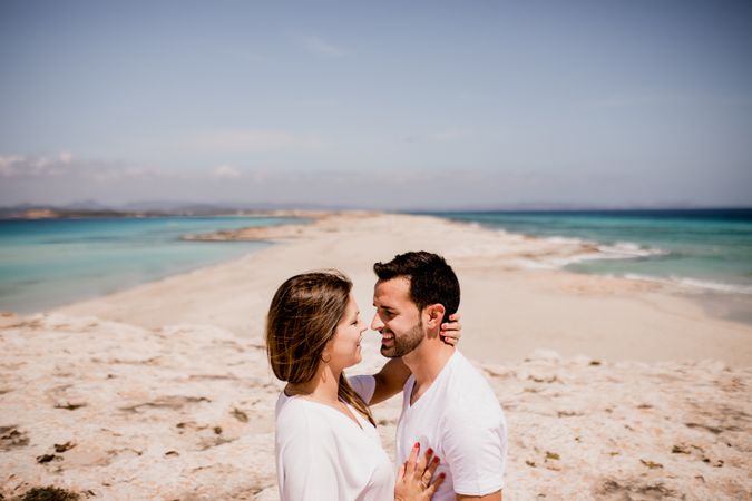 Loving couple embracing on coastline