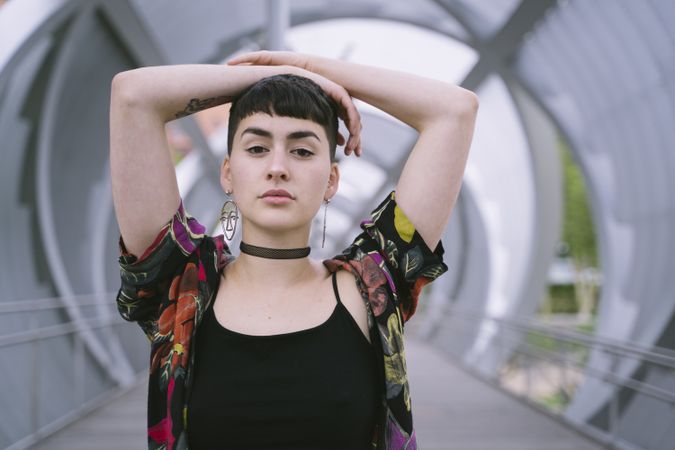 Woman in colorful shirt posing