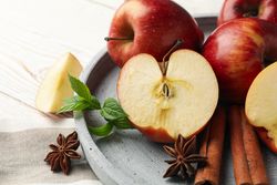 Plate of apples, anise and cinnamon sticks