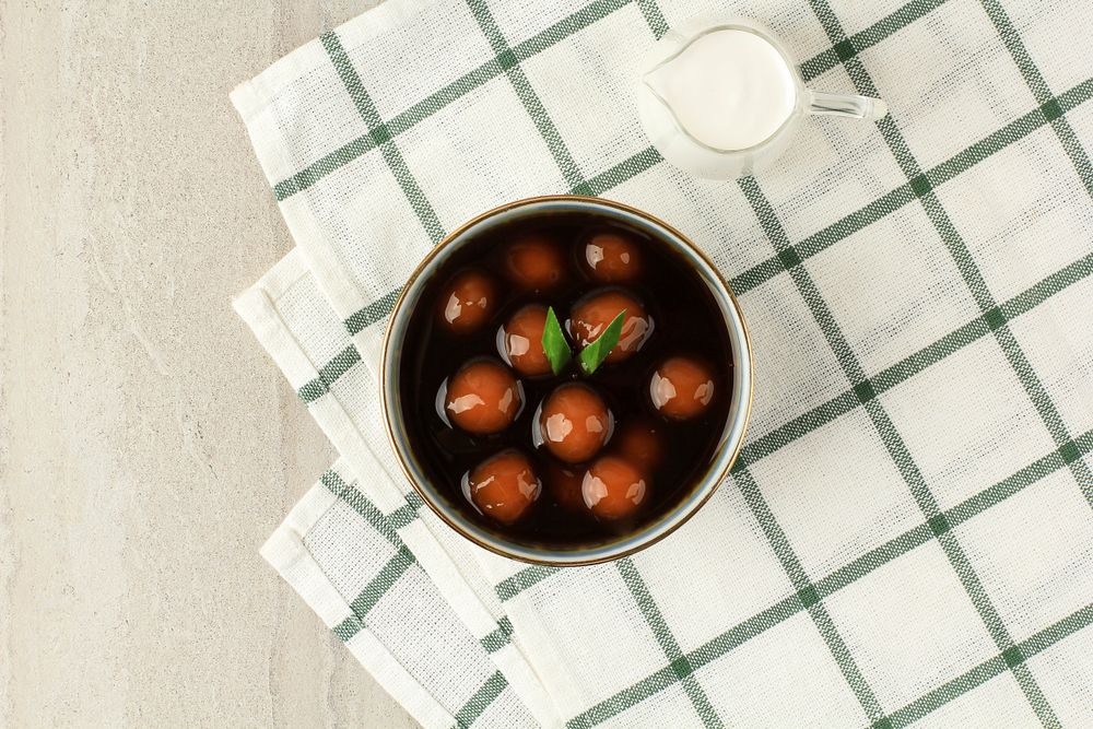 Top view of bowl of  kolak candil with space for text