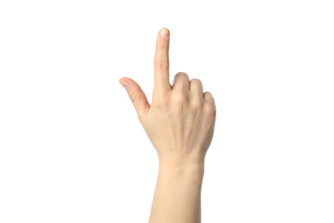 Female hand showing finger, isolated on plain background. Gestures