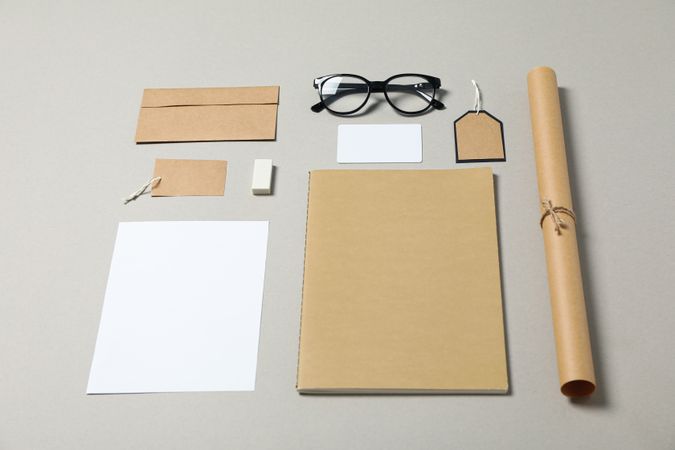 Mockup. Corporate stationery and glasses on grey background, copy space