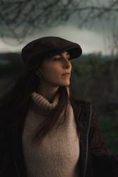 Young woman in warm clothes in forest