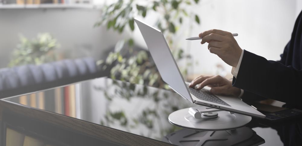 Businessman Working on Laptop at Office Desk