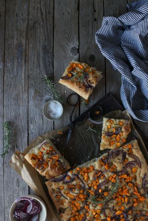 top view of Pieces of fresh focaccia on wooden table