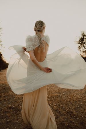 Woman in dress posing on nature