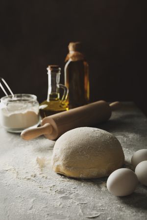 Concept for baking with dough on gray background