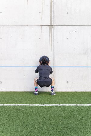 Man training with ball near wall