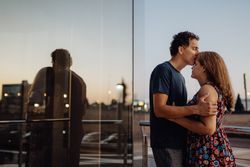 Romantic couple in sunlight in city street