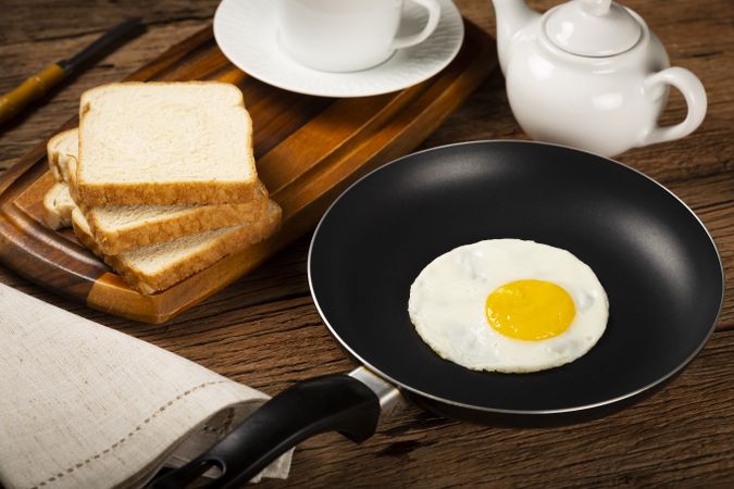 Breakfast with fried egg in the frying pan.