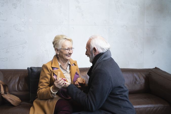 Joyful mature couple in the middle of a marriage proposal