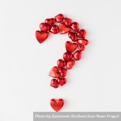 Question mark made of red foil hearts on light background 0JgJr5