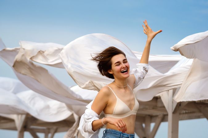 Woman on beach on windy day