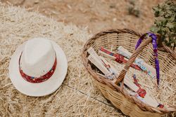 Hat and basket with hand fans on straw
