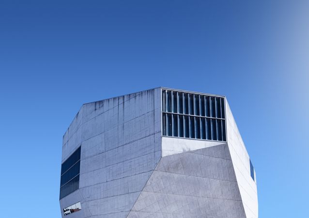Uniquely shaped building against a blue sky