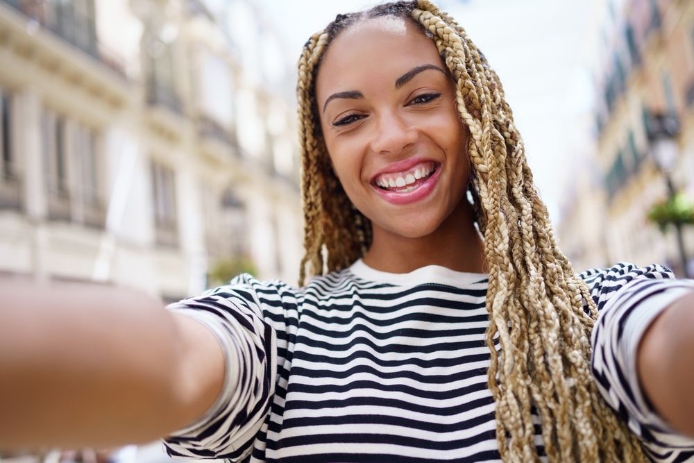 POV view of happy woman taking selfie