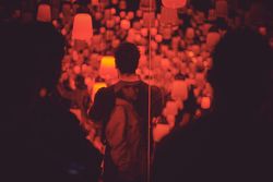 Tokyo, Japan - November 19th, 2019: People looking at an art exhibition featuring red lanterns