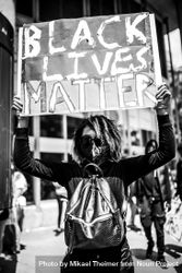 MONTREAL, QUEBEC, CANADA – June 7 2020- Woman holding “Black Lives Matter” sign 56lExb