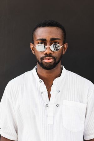 Black man in trendy clothes in city