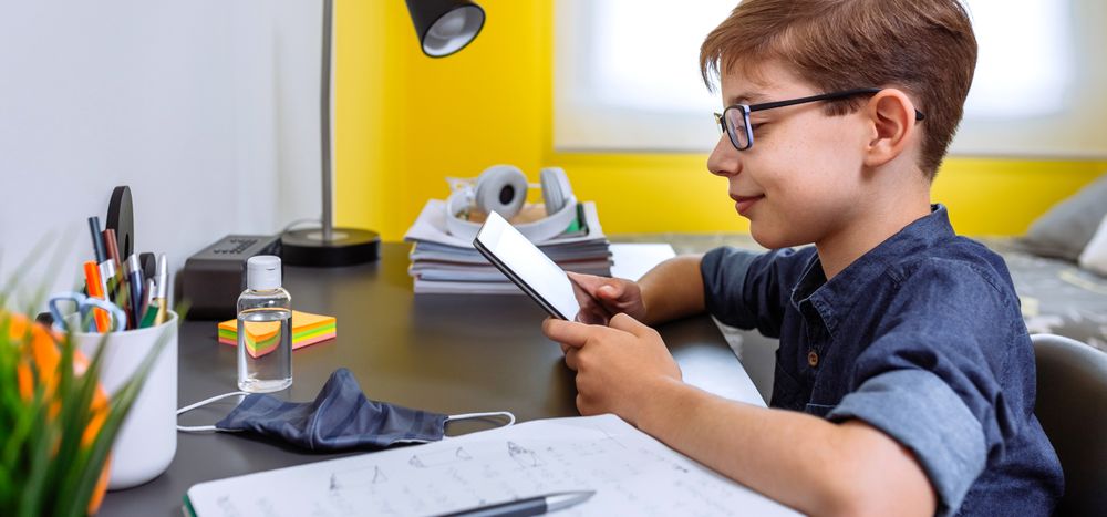 Teenager doing homework with a tablet