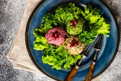 Top view of vegetable Georgian dish pkhali on a bed of lettuce