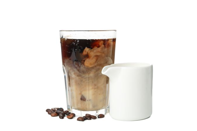 Glass of ice coffee isolated on plain background
