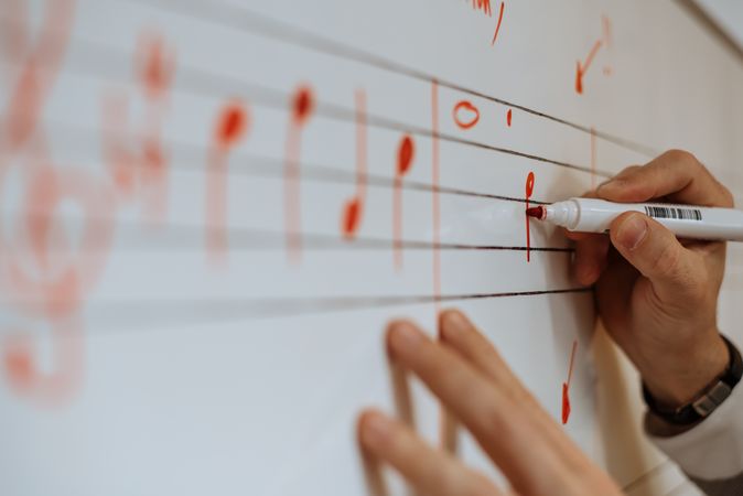 Man writing music notes