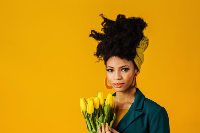 Portrait of Black woman with tulips