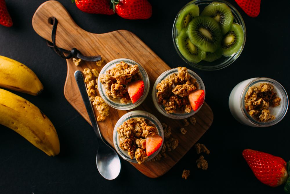 Flat lay of fruits and walnuts in milk