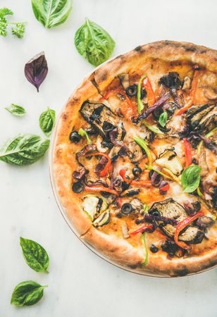 Top view of wood fire oven cooked vegetable pizza