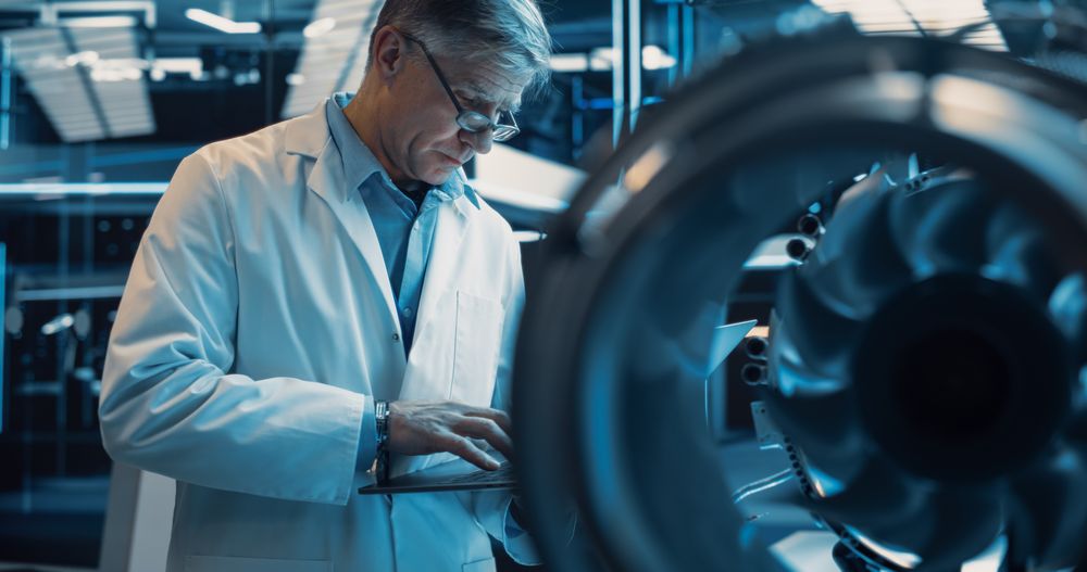Software Developer and Machinery Operator Working on a Prototype Turbine Engine