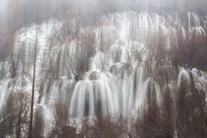Wonderful waterfall near tree