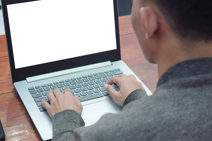Close up of back of person working remote at home