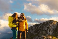 man and woman hiking in the mountains