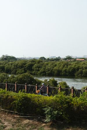 Man cycling along the river